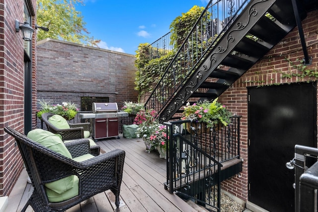 wooden deck with area for grilling