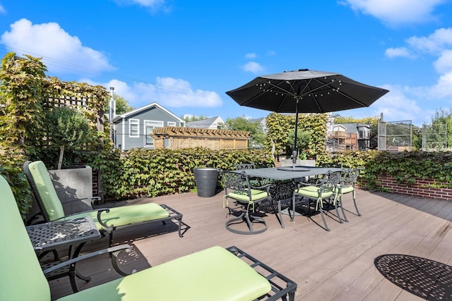 deck with outdoor dining area