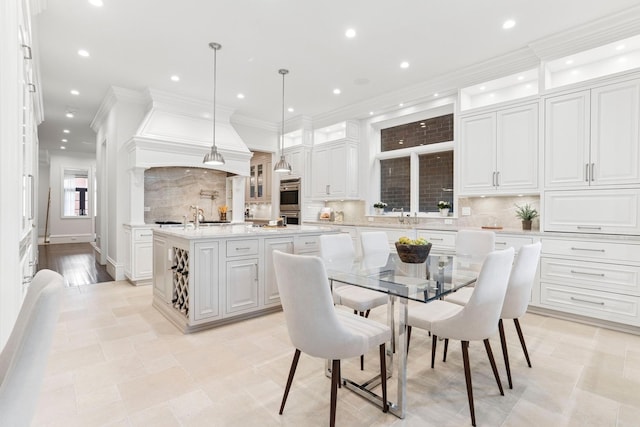 dining area with crown molding and recessed lighting