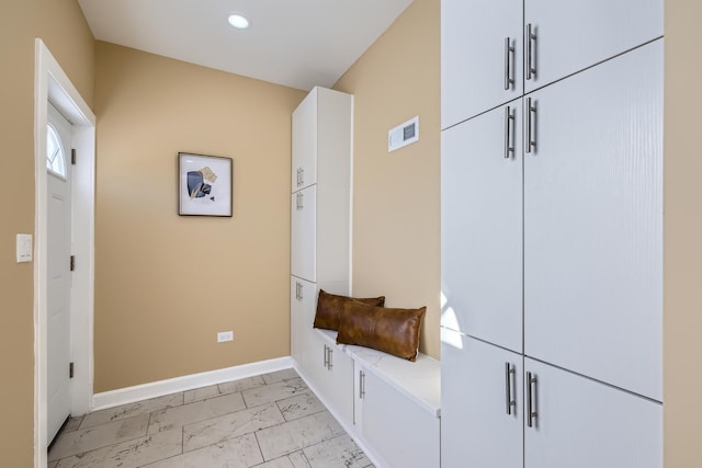 mudroom with baseboards, marble finish floor, visible vents, and recessed lighting