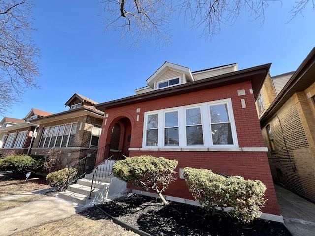 view of front facade featuring brick siding