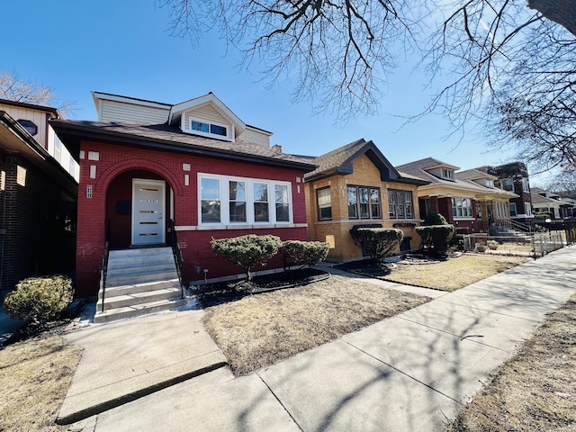 view of front of house with brick siding