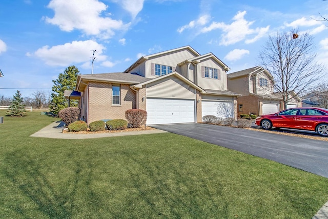 11042 Quail Dr, Mokena, IL 60448 - view of front of home with brick siding, a garage, aphalt driveway, and a front lawn