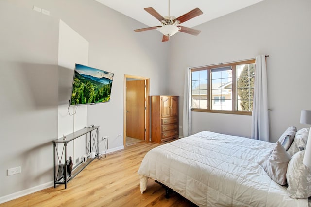 11042 Quail Dr, Mokena, IL 60448 - bedroom featuring a high ceiling, baseboards, and wood finished floors
