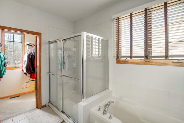 11042 Quail Dr, Mokena, IL 60448 - full bathroom with a shower stall, visible vents, a spacious closet, and a bath