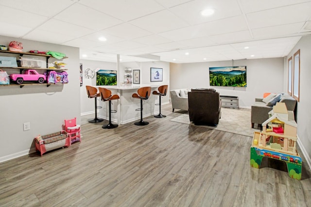 11042 Quail Dr, Mokena, IL 60448 - game room with baseboards, wood finished floors, bar area, and a drop ceiling