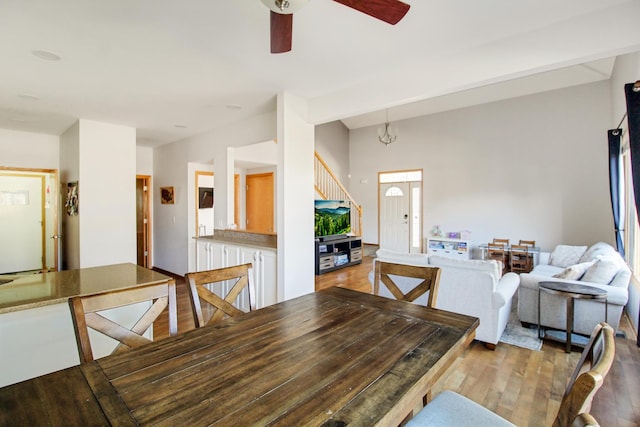 11042 Quail Dr, Mokena, IL 60448 - dining area featuring light wood-style floors, stairway, and a ceiling fan