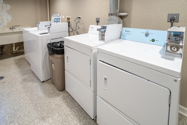 shared laundry area with separate washer and dryer