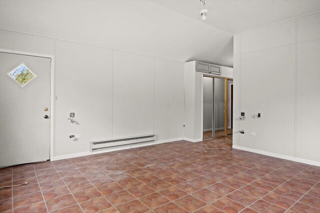 769 Bonita Ave, Elk Grove Village, IL 60007 - spare room with a baseboard heating unit and vaulted ceiling