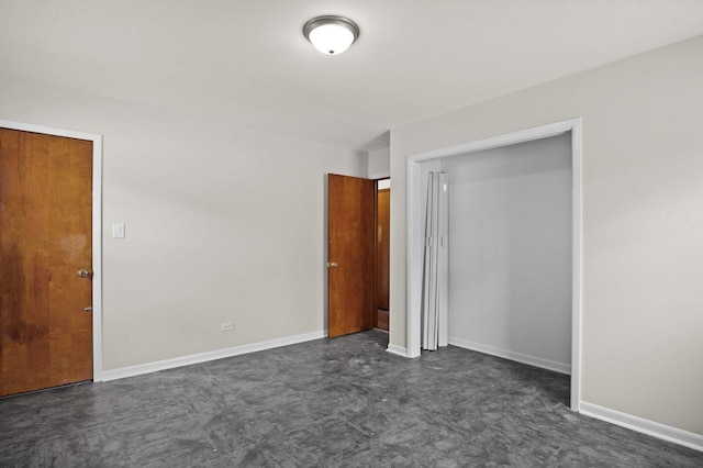 769 Bonita Ave, Elk Grove Village, IL 60007 - unfurnished bedroom featuring baseboards and a closet