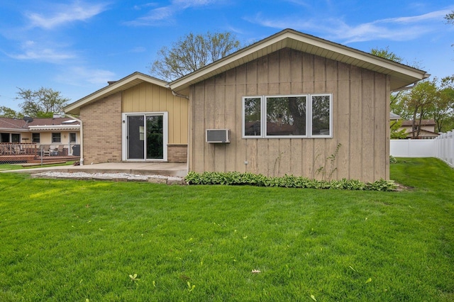 769 Bonita Ave, Elk Grove Village, IL 60007 - back of property with a patio area, board and batten siding, brick siding, and a wall mounted AC