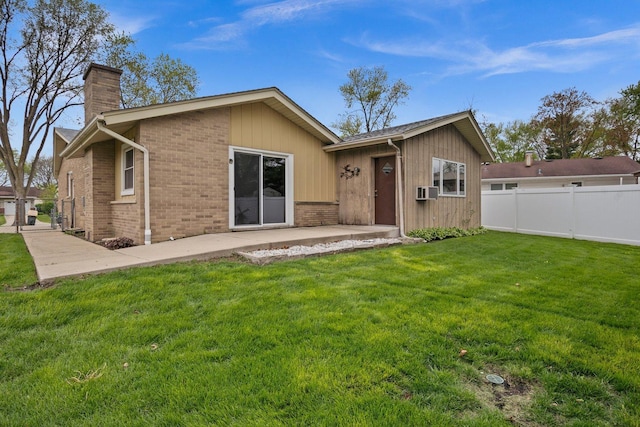 769 Bonita Ave, Elk Grove Village, IL 60007 - rear view of house with a chimney, brick siding, and a patio