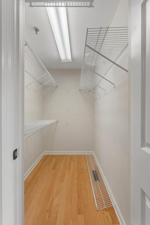 spacious closet with wood finished floors