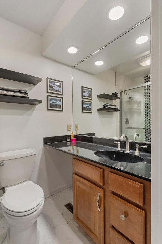 bathroom featuring vanity, recessed lighting, toilet, marble finish floor, and a stall shower