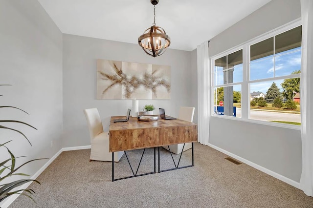 carpeted dining space with a notable chandelier, baseboards, and visible vents