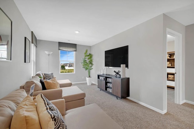 living room with carpet floors and baseboards
