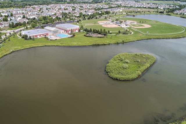 drone / aerial view with a residential view and a water view