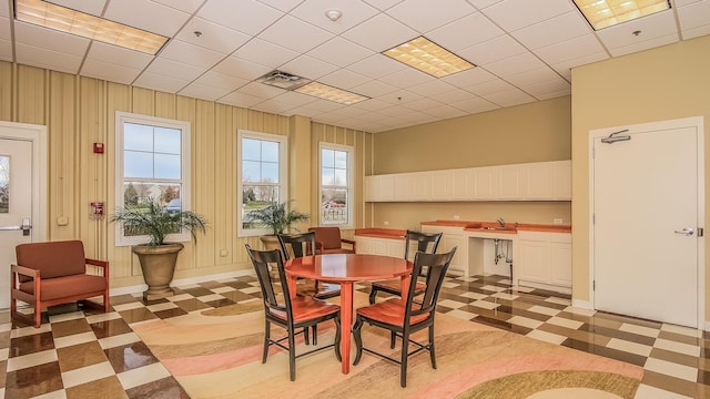 dining area featuring plenty of natural light, baseboards, visible vents, and light floors