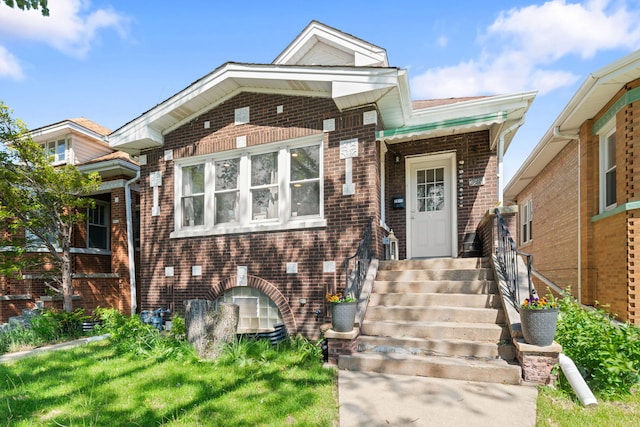 view of front of house with brick siding