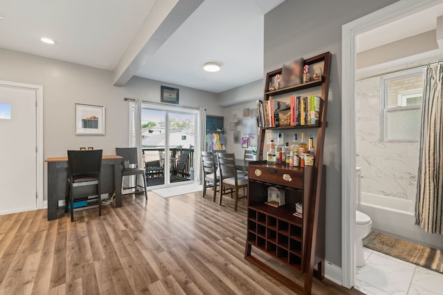 office featuring plenty of natural light, baseboards, beamed ceiling, and recessed lighting