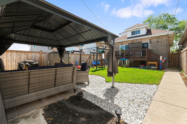 view of patio / terrace featuring a deck, a gazebo, and an outdoor hangout area