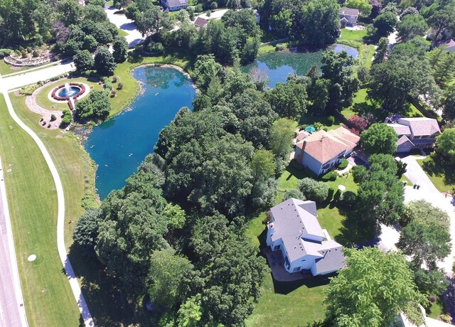 birds eye view of property featuring a water view and a residential view