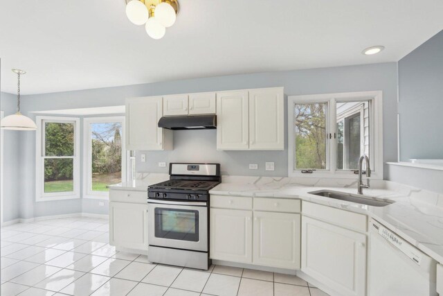 kitchen with a healthy amount of sunlight, gas range, dishwasher, a sink, and under cabinet range hood