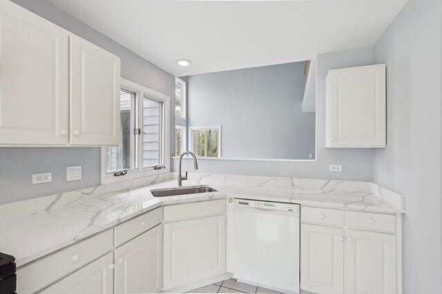 kitchen with light stone countertops, a sink, dishwasher, white cabinetry, and recessed lighting