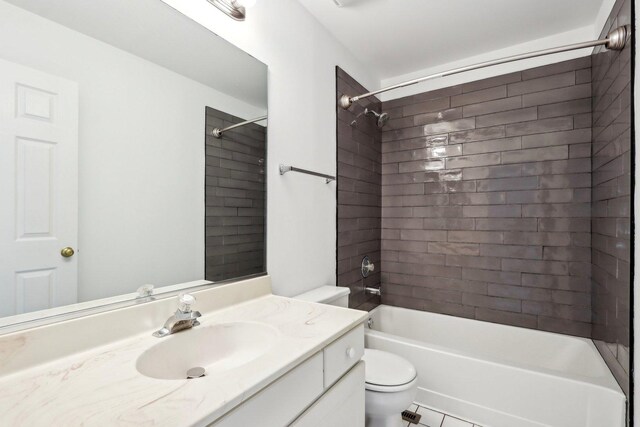 bathroom with vanity, tile patterned floors, toilet, and tub / shower combination