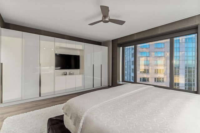 bedroom featuring ceiling fan and wood finished floors