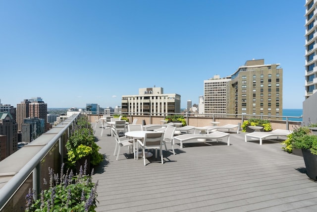 deck featuring a water view and a city view