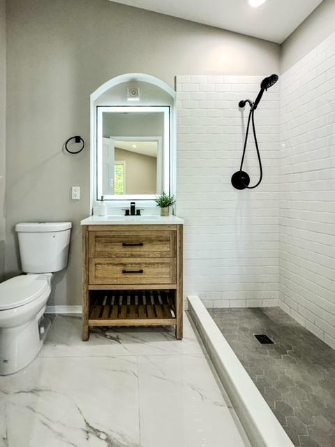 13110 W Playfield Dr, Crestwood, IL 60418 - full bathroom featuring vanity, tiled shower, and marble finish flooring