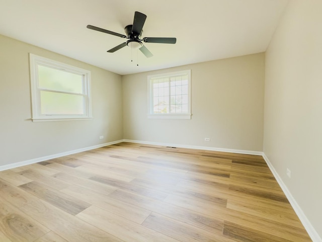 13110 W Playfield Dr, Crestwood, IL 60418 - spare room featuring healthy amount of natural light, light wood-style floors, and ceiling fan