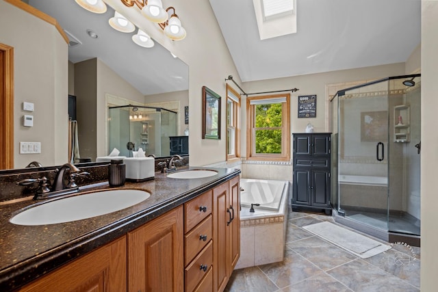 2527 Ryan Ct, Naperville, IL 60564 - full bathroom featuring vaulted ceiling, a shower stall, a skylight, a garden tub, and double vanity