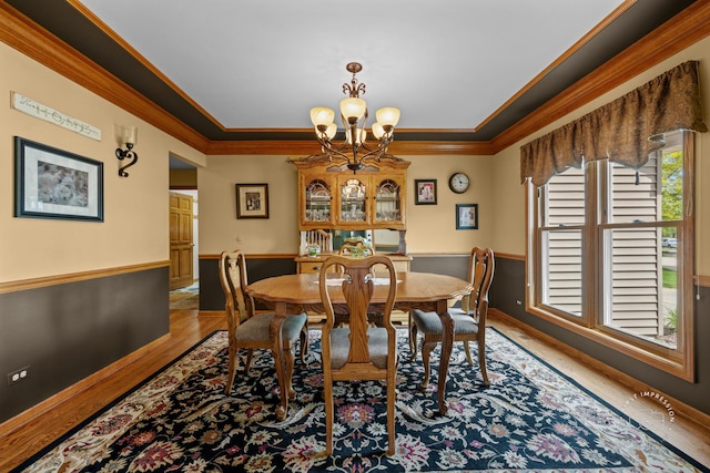 2527 Ryan Ct, Naperville, IL 60564 - dining space featuring a chandelier, wood finished floors, ornamental molding, and baseboards