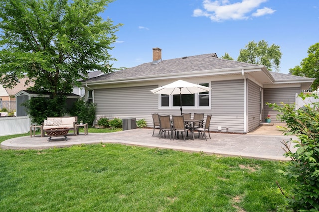 231 W Hickory Rd, Lombard, IL 60148 - rear view of property featuring a fire pit, a patio area, a shingled roof, and a chimney
