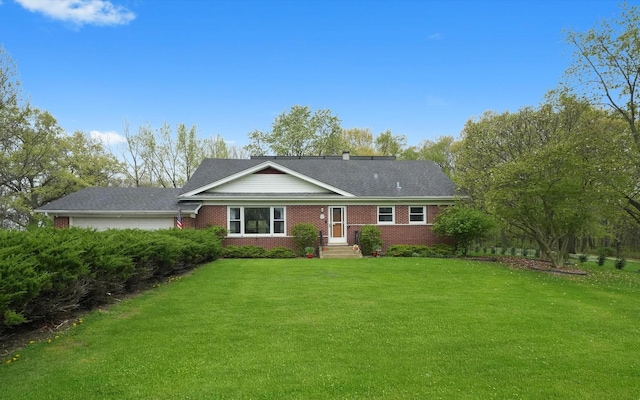 view of front facade featuring a front lawn and brick siding