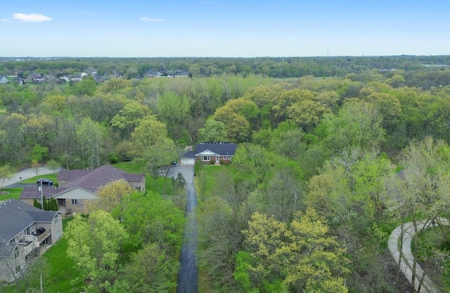 drone / aerial view featuring a view of trees