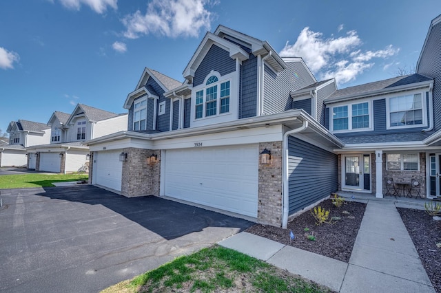 3924 Garnette Ct, Naperville, IL 60564 - view of front of house featuring a garage, aphalt driveway, and brick siding