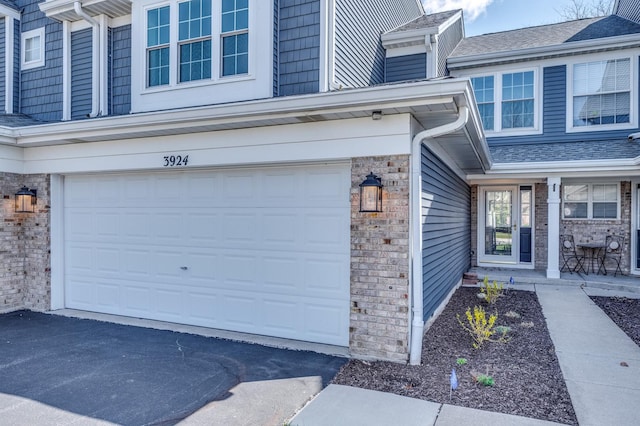 3924 Garnette Ct, Naperville, IL 60564 - entrance to property featuring an attached garage, driveway, and brick siding
