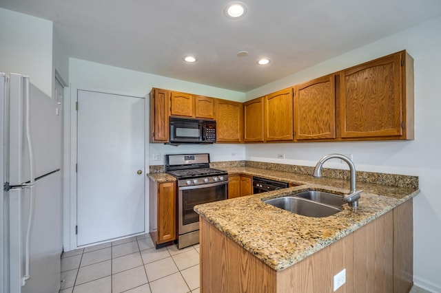 3924 Garnette Ct, Naperville, IL 60564 - kitchen featuring freestanding refrigerator, black microwave, a peninsula, gas stove, and a sink