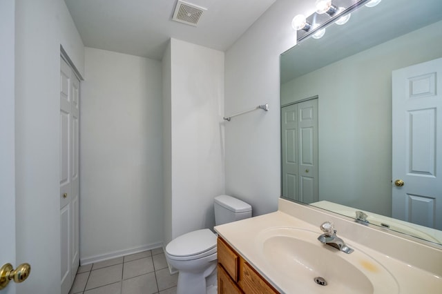 3924 Garnette Ct, Naperville, IL 60564 - half bathroom featuring a closet, vanity, tile patterned flooring, visible vents, and toilet