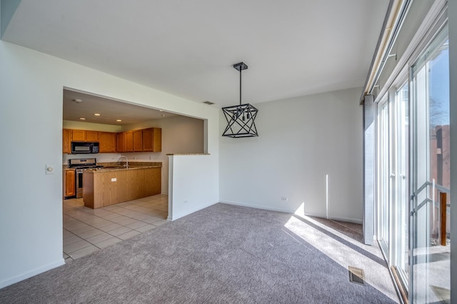 3924 Garnette Ct, Naperville, IL 60564 - unfurnished dining area with visible vents, baseboards, light tile patterned floors, a sink, and light colored carpet