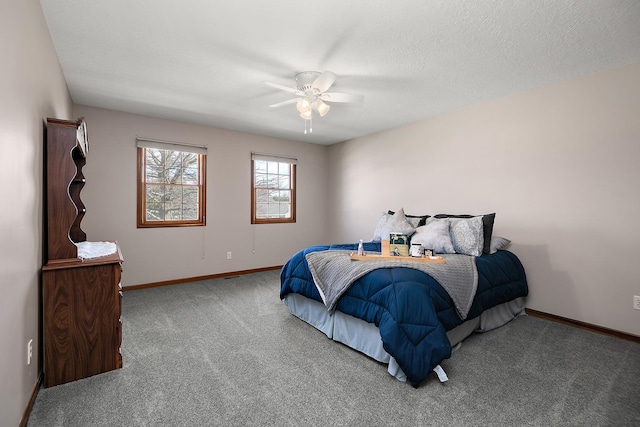 909 Revere St, Bourbonnais, IL 60914 - bedroom featuring baseboards, carpet flooring, a textured ceiling, and ceiling fan