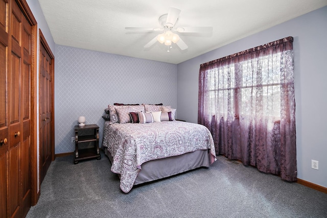 909 Revere St, Bourbonnais, IL 60914 - carpeted bedroom featuring baseboards, wallpapered walls, a closet, and ceiling fan
