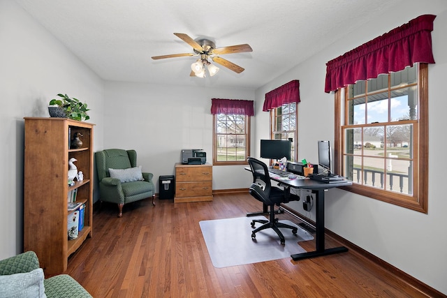 909 Revere St, Bourbonnais, IL 60914 - home office with baseboards, ceiling fan, and wood finished floors