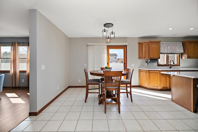909 Revere St, Bourbonnais, IL 60914 - dining room with light tile patterned floors, baseboards, a healthy amount of sunlight, and recessed lighting