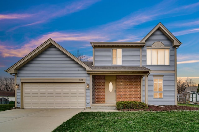 traditional home featuring a shingled roof, an attached garage, concrete driveway, brick siding, and a front lawn