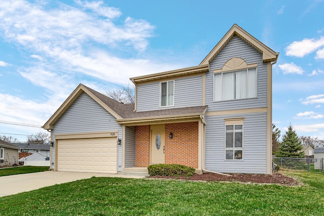 traditional-style home featuring driveway, a front yard, fence, and brick siding