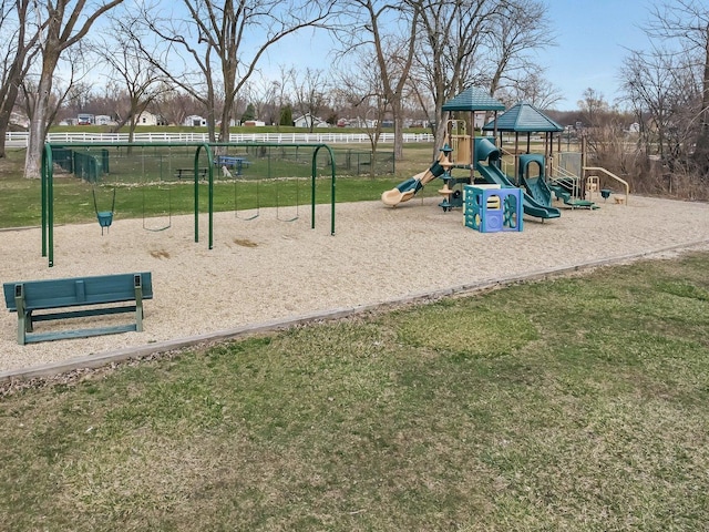 communal playground featuring a yard